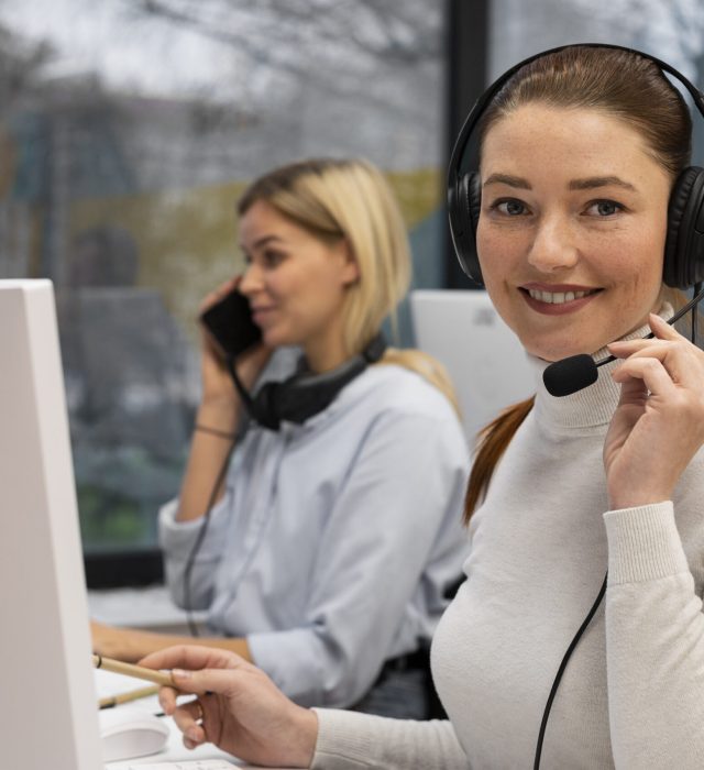 woman-working-call-center-talking-with-clients-using-headphones-microphone